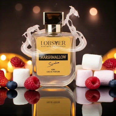 Perfume bottle labeled 'Lobster Marshmallow' with berries and marshmallows on a reflective surface.