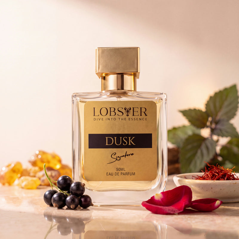 Dusk eau de parfum on a cream studio set with blackcurrants, rose petals and saffron