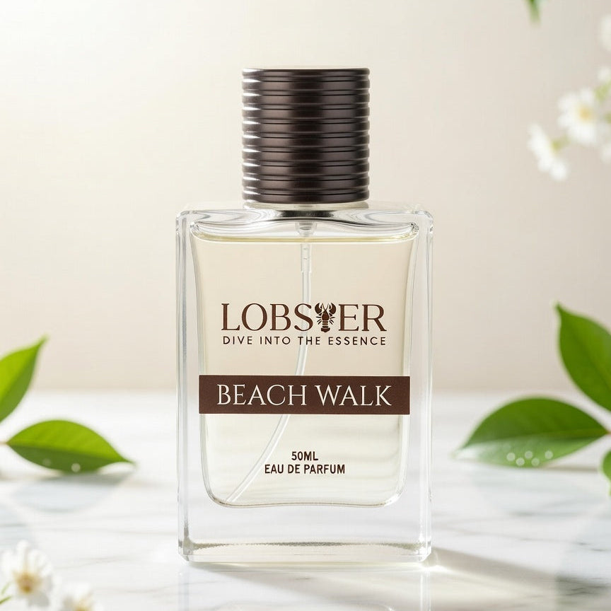 Perfume bottle labeled 'Lobster Beach Walk' with green leaves and flowers in the background