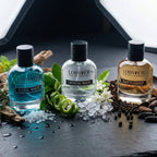 Three bottles of Lobster brand products on a dark surface with decorative elements.