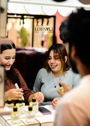 Two women in a beauty store looking at products with a customer.