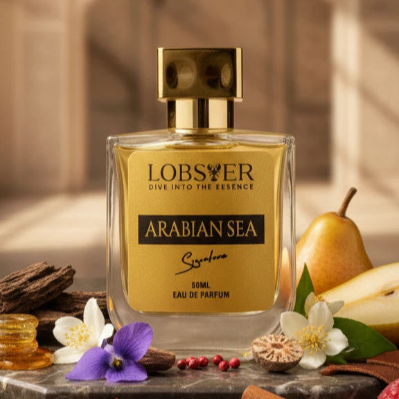 Lobster Arabian Sea perfume bottle with ingredients on a stone surface